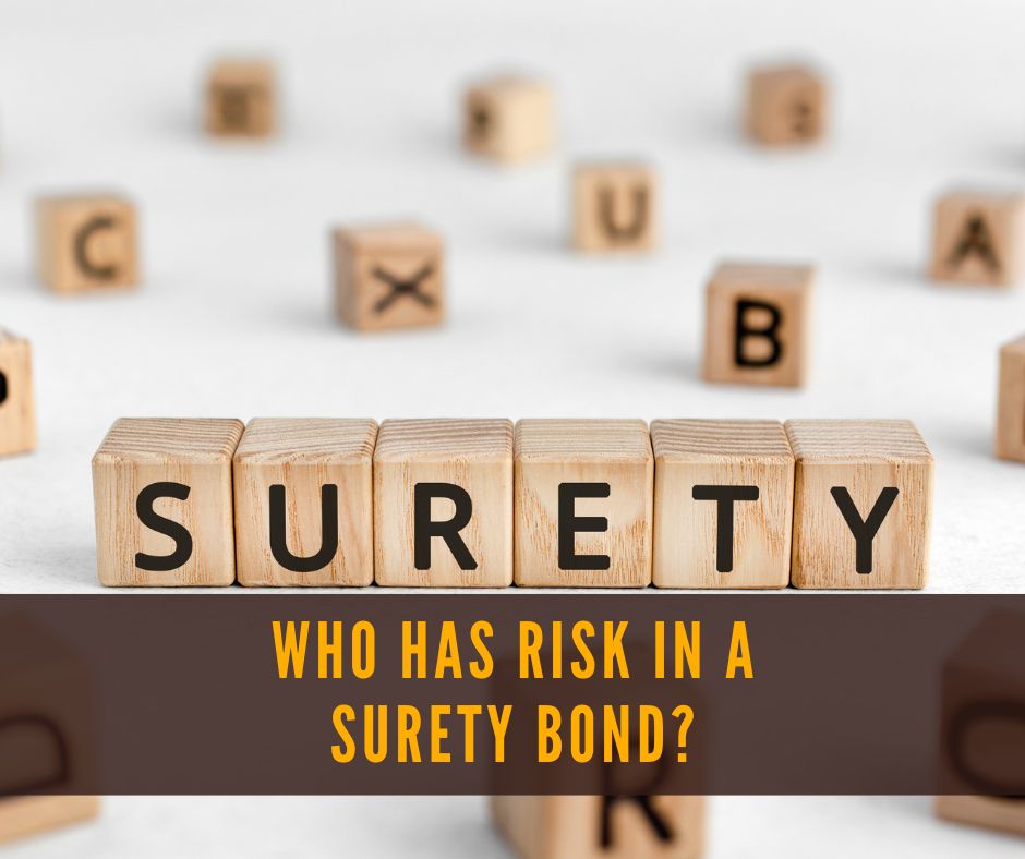 Who has risk in a Surety Bond? A surety bond is written on a cube of wood on a table.